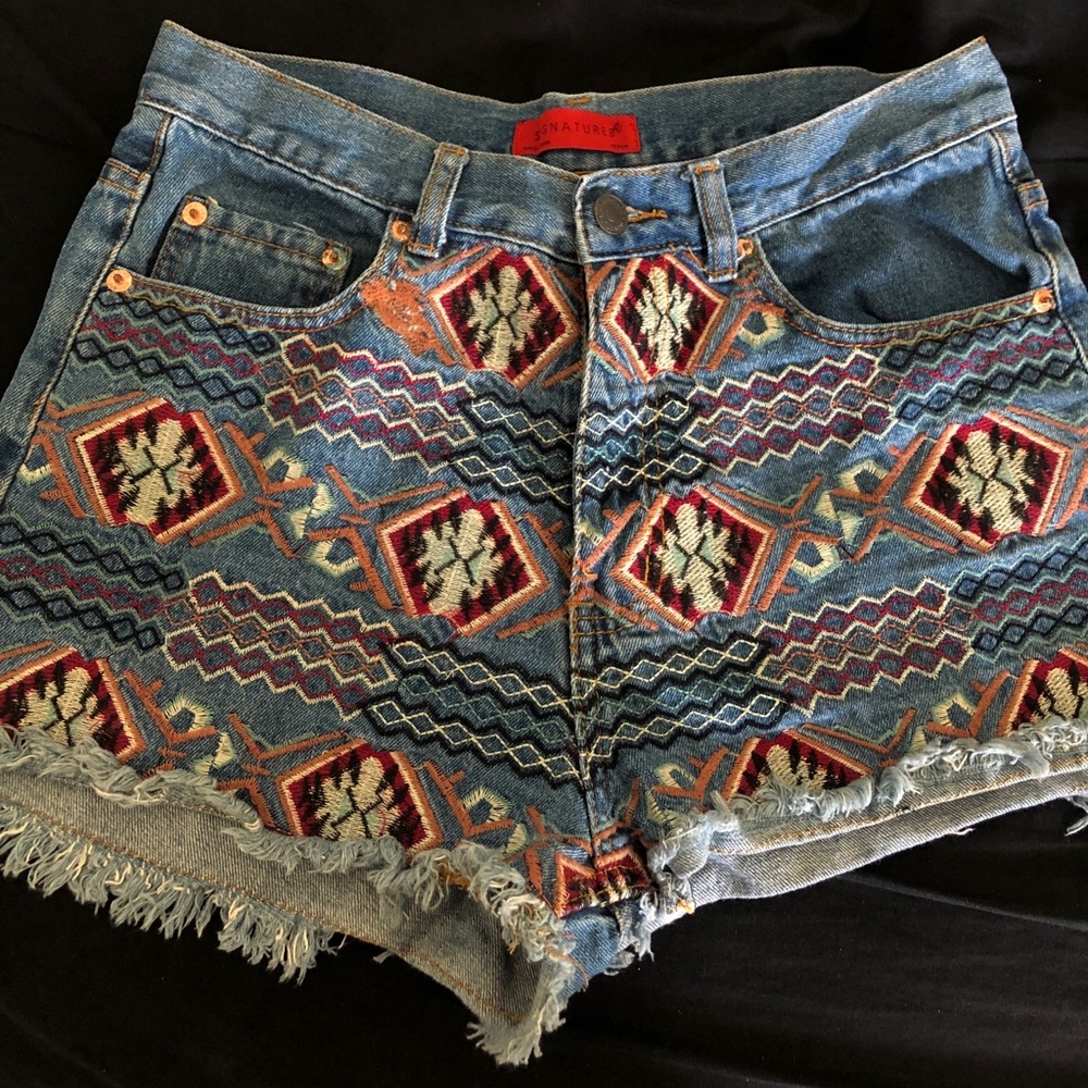 Denim blue shorts with Aztec and tribal patterns
